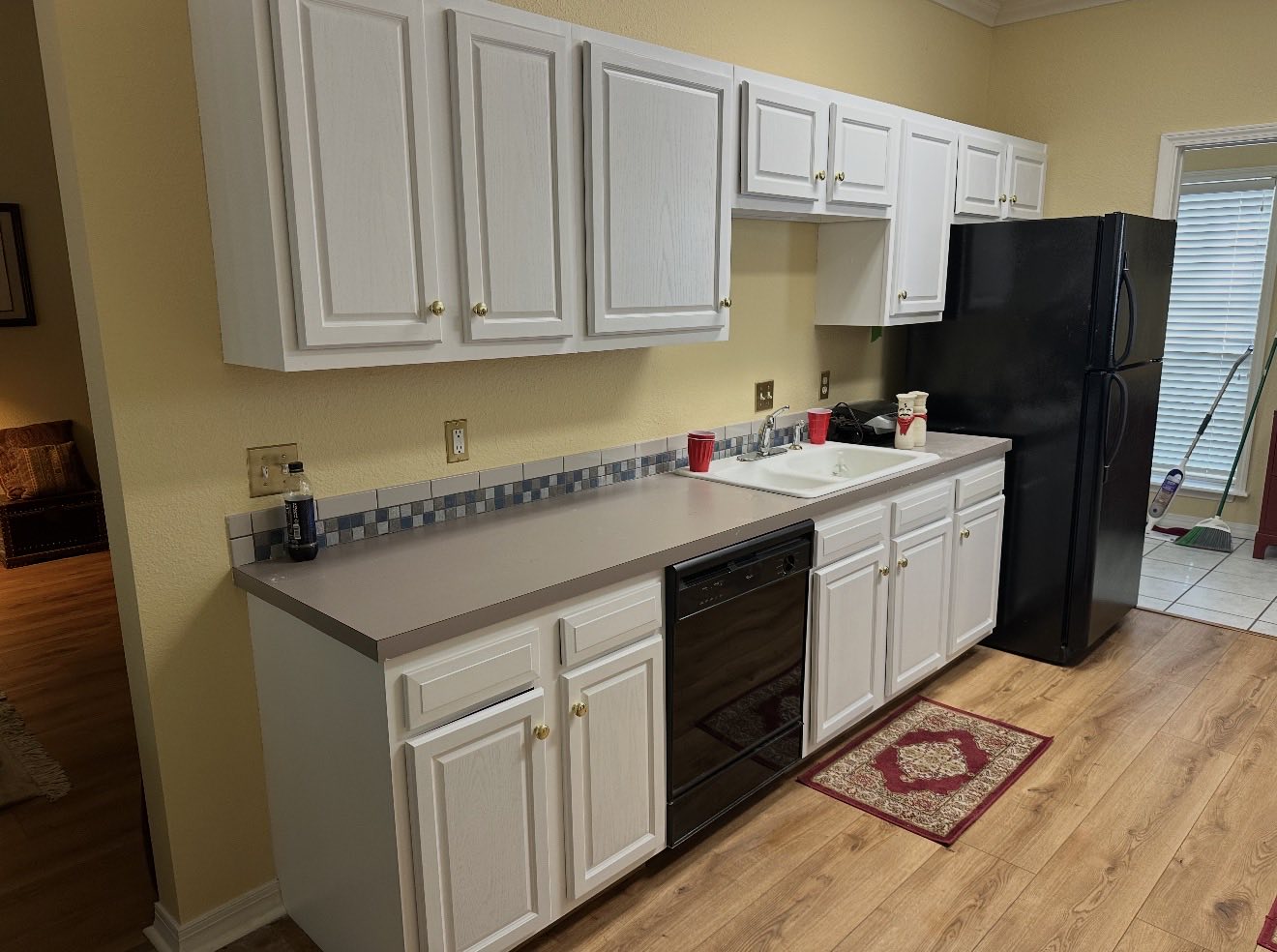 A row of kitchen cabinets freshly painted white